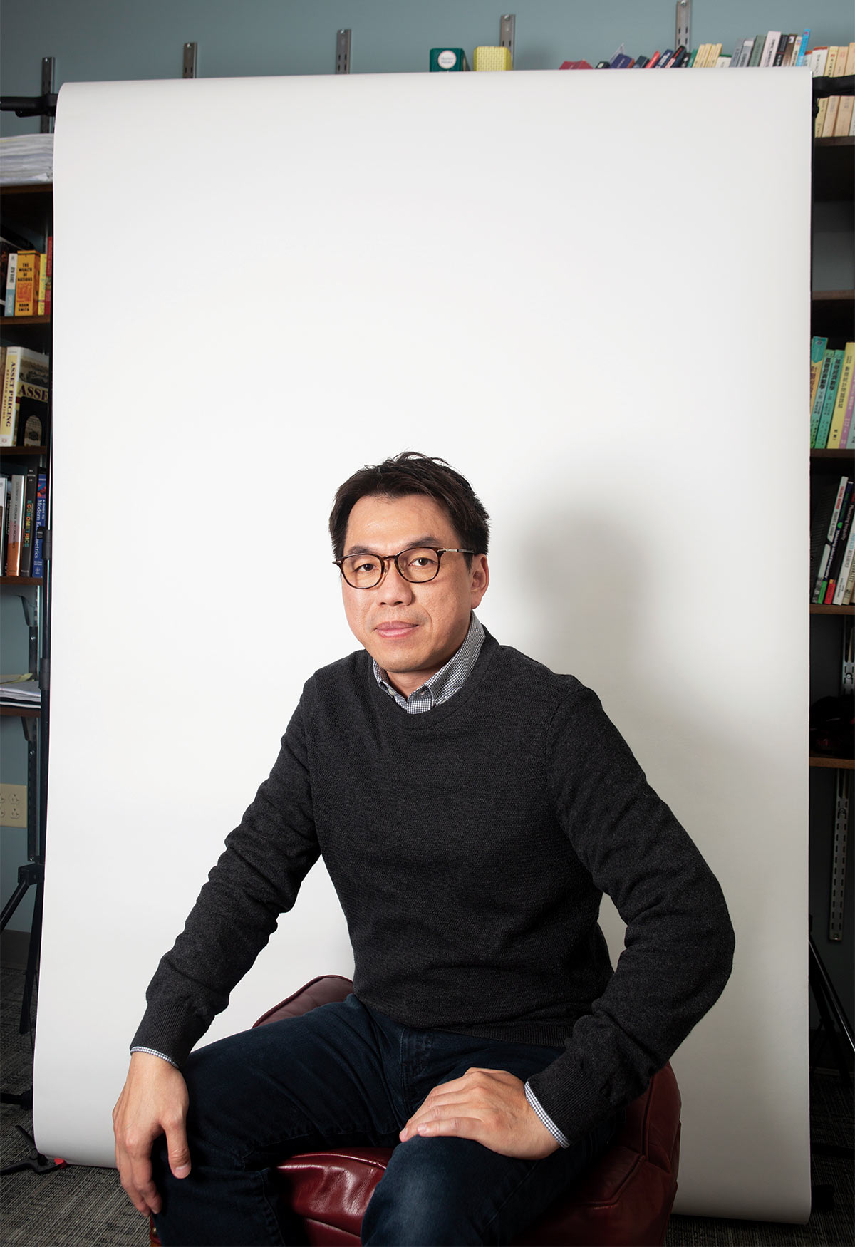 Professor Carl Lin in front of white backdrop