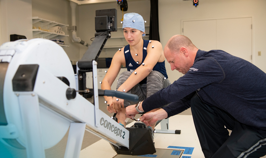 Bucknell student on a rowing machine