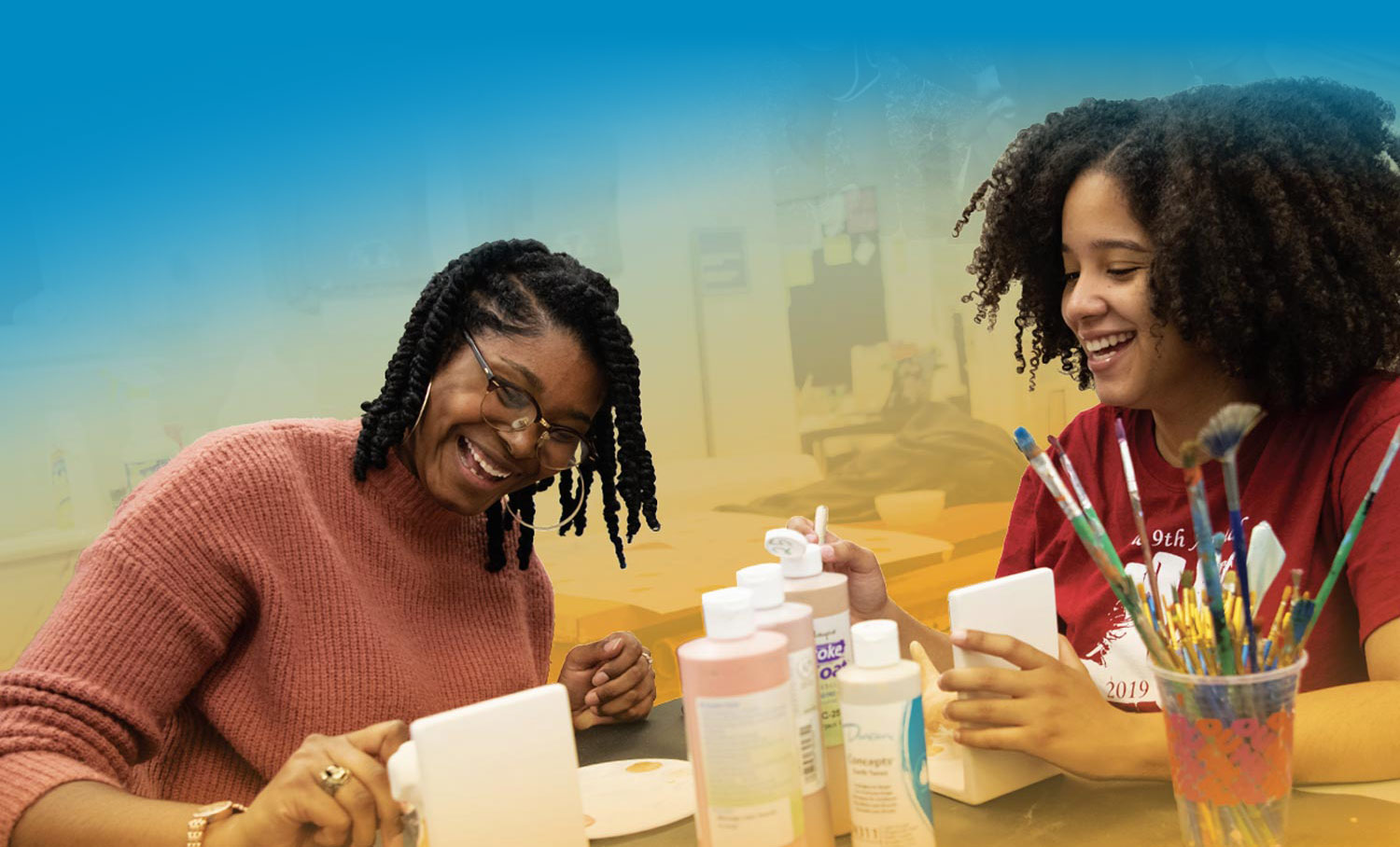 Bucknell students painting in an art classroom