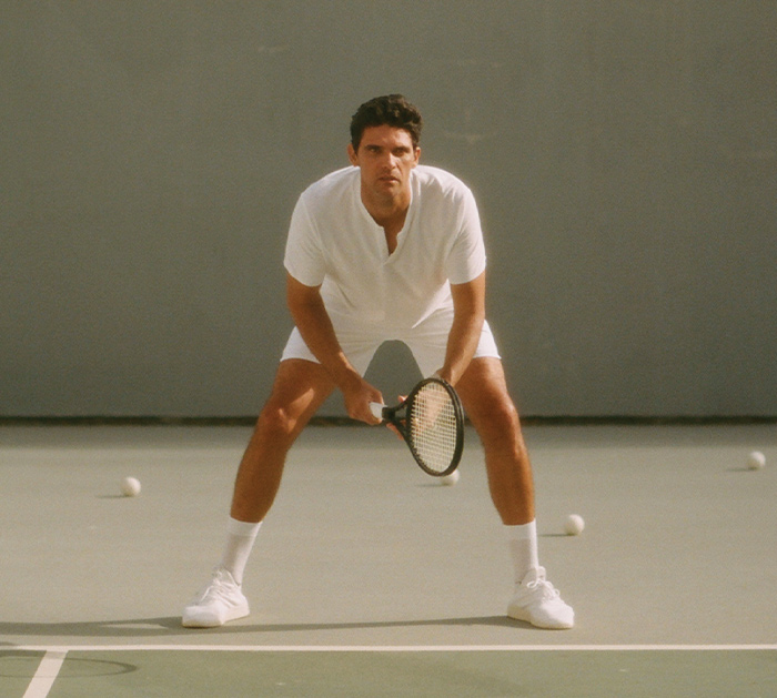 Mark Philippoussis wears JACQUES tennis whites on the court