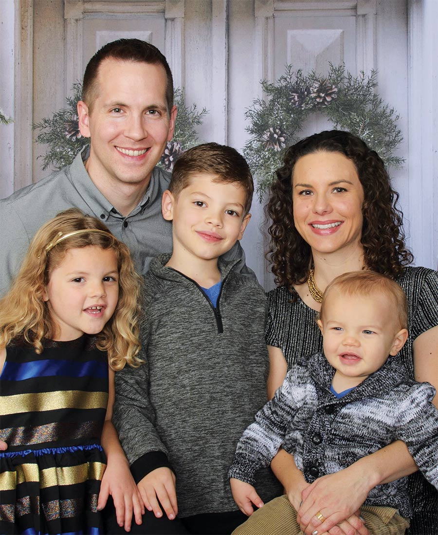 Dual-career couple Justin ’01 and Catherine Rasch Miller ’01, with Caroline, Andrew and Evan, see the value in domestic labor.