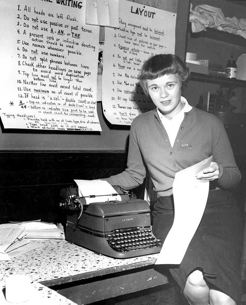 Vintage photograph of a woman by a type writer