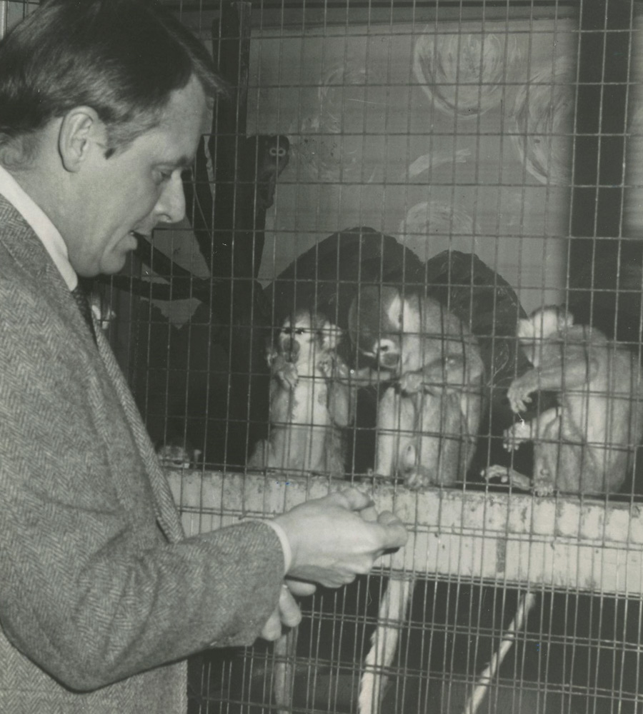 Doug Candland greeting animals in the primate lab