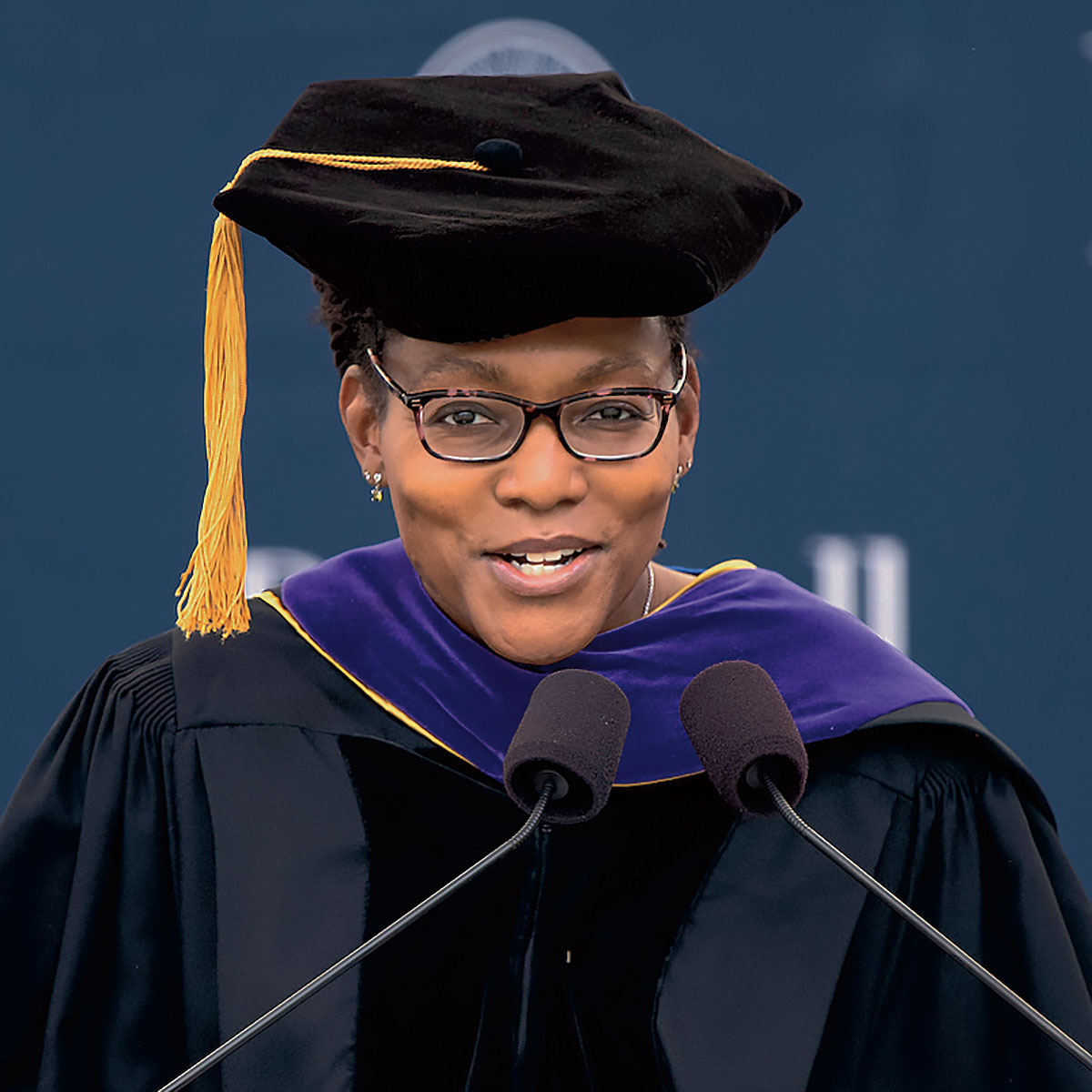 Audra Wilson ’94 in a teacher's graduation cap and gown giving her keynote address at Bucknell’s 171st Commencement