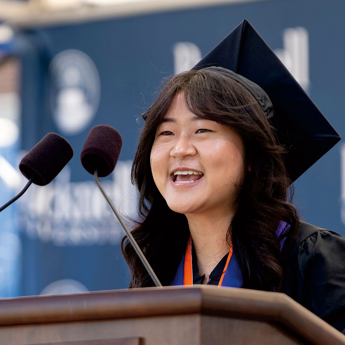 Ruby Lee ’21 in a graduation cap and gown giving her speech at at Bucknell’s 171st Commencement