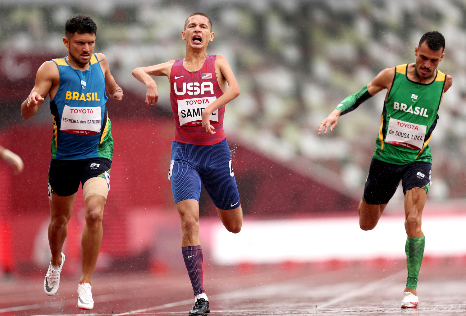 Rayven Sample ’24 (center), a sprinter on the Bucknell track and field team, flanked by runners from Brazil, competed in the final of the men’s 400 meters (T45 classification) at the Paralympic Games in Tokyo on Sept. 3