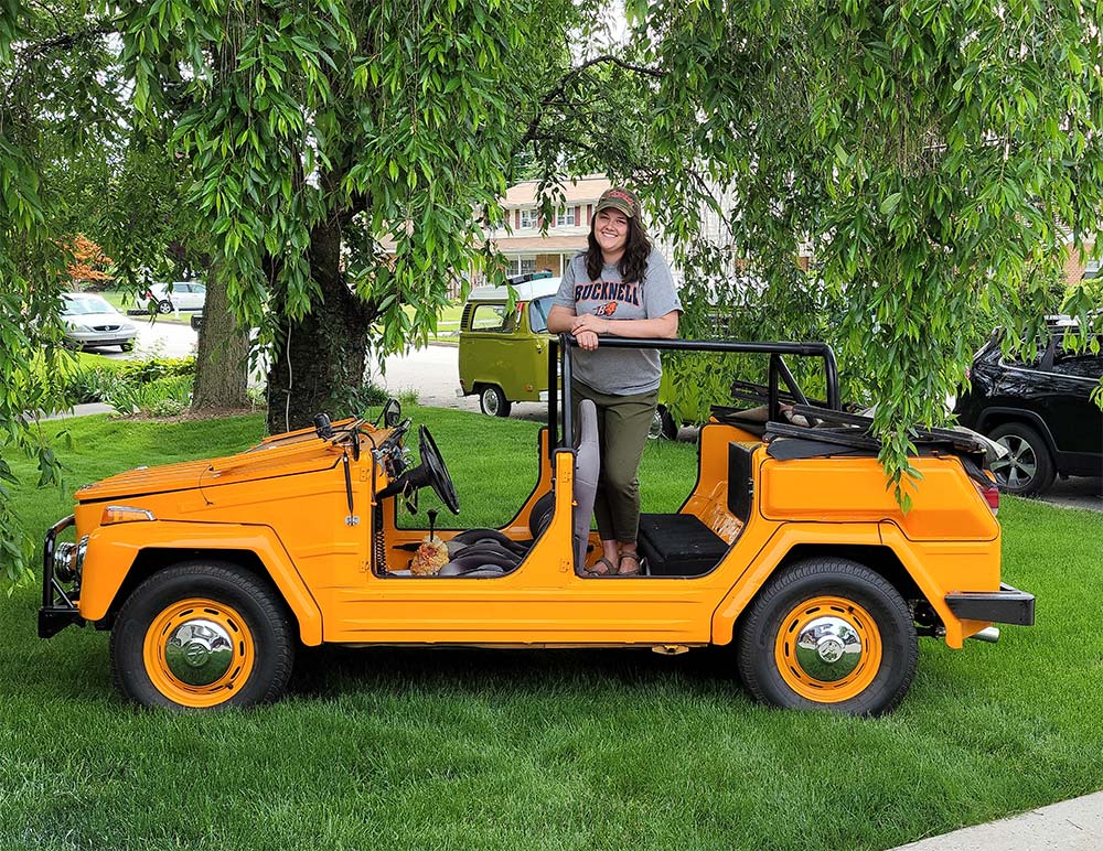 Erin Wolfe Tadich ’09 with the 47-year-old VW Thing she and her husband rent to partygoers