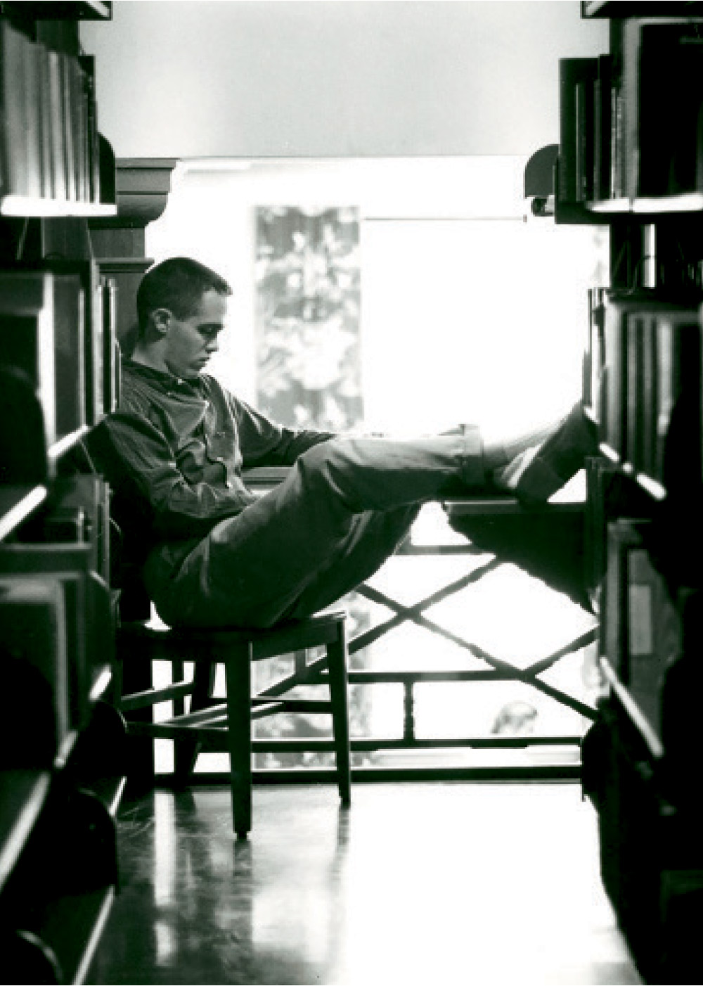 Student reading a book in the Bucknell library