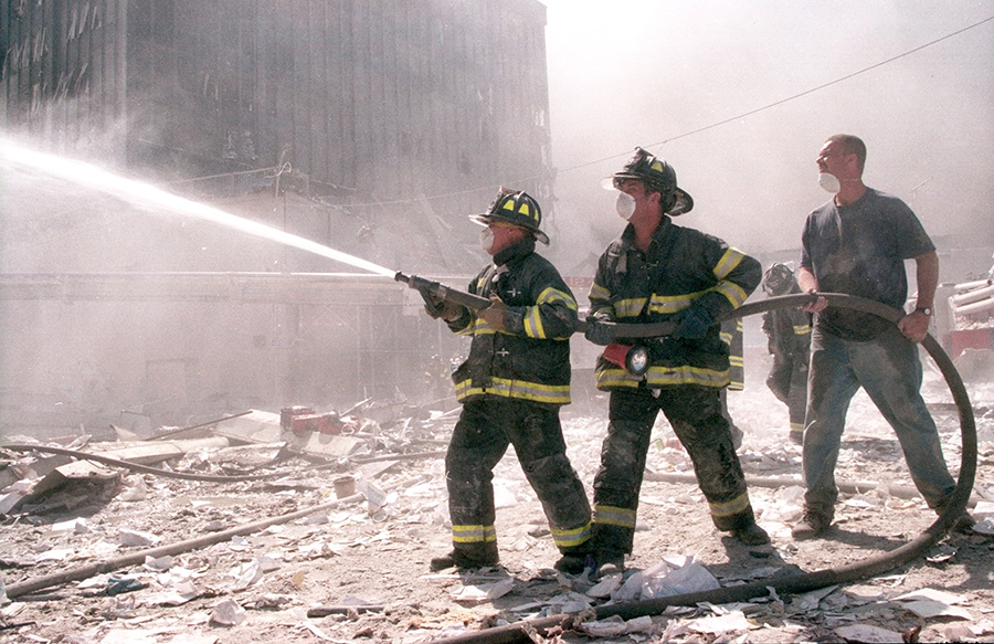 Firefighters battle the World Trade Center blaze after the terrorist attack on Sept. 11, 2001