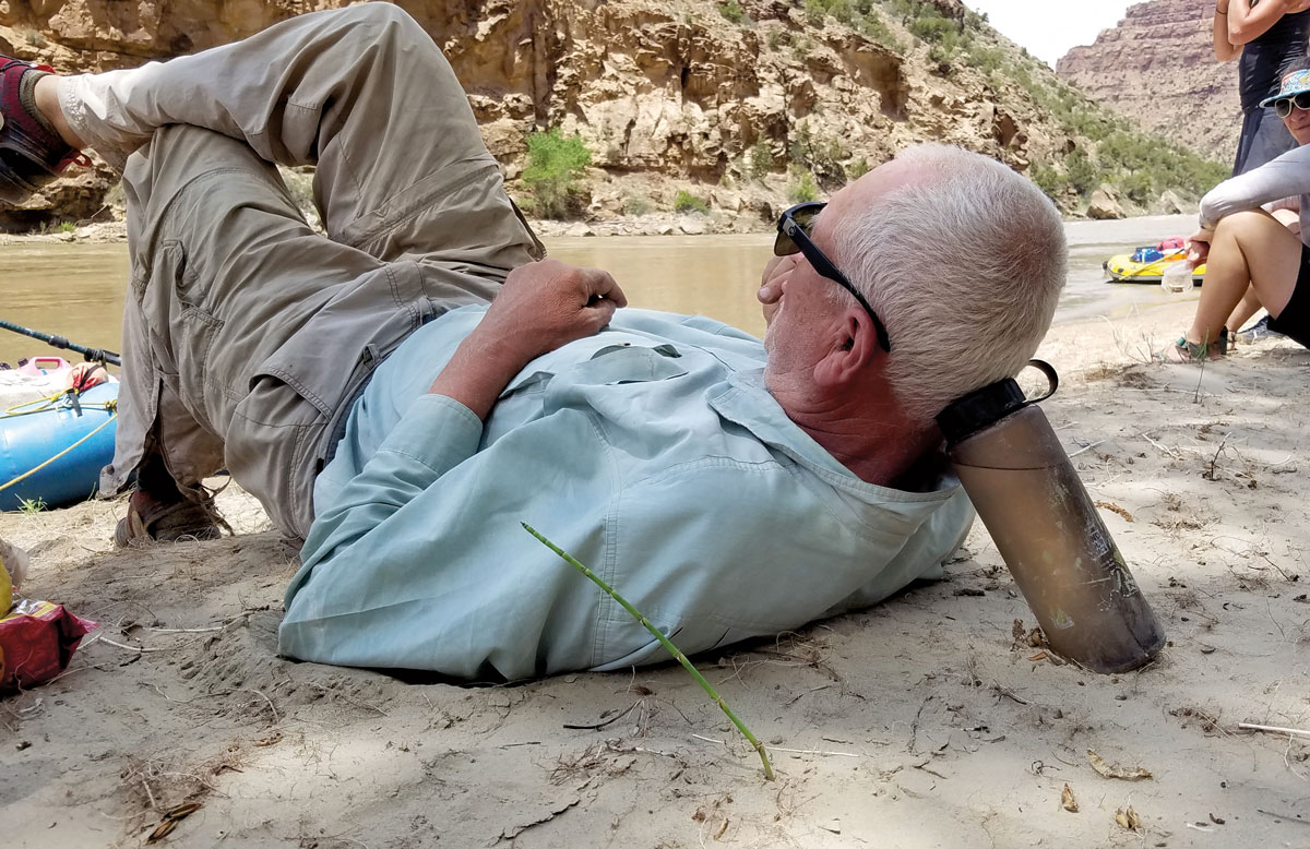 Jack Schmidt ’72 takes a break during a river expedition