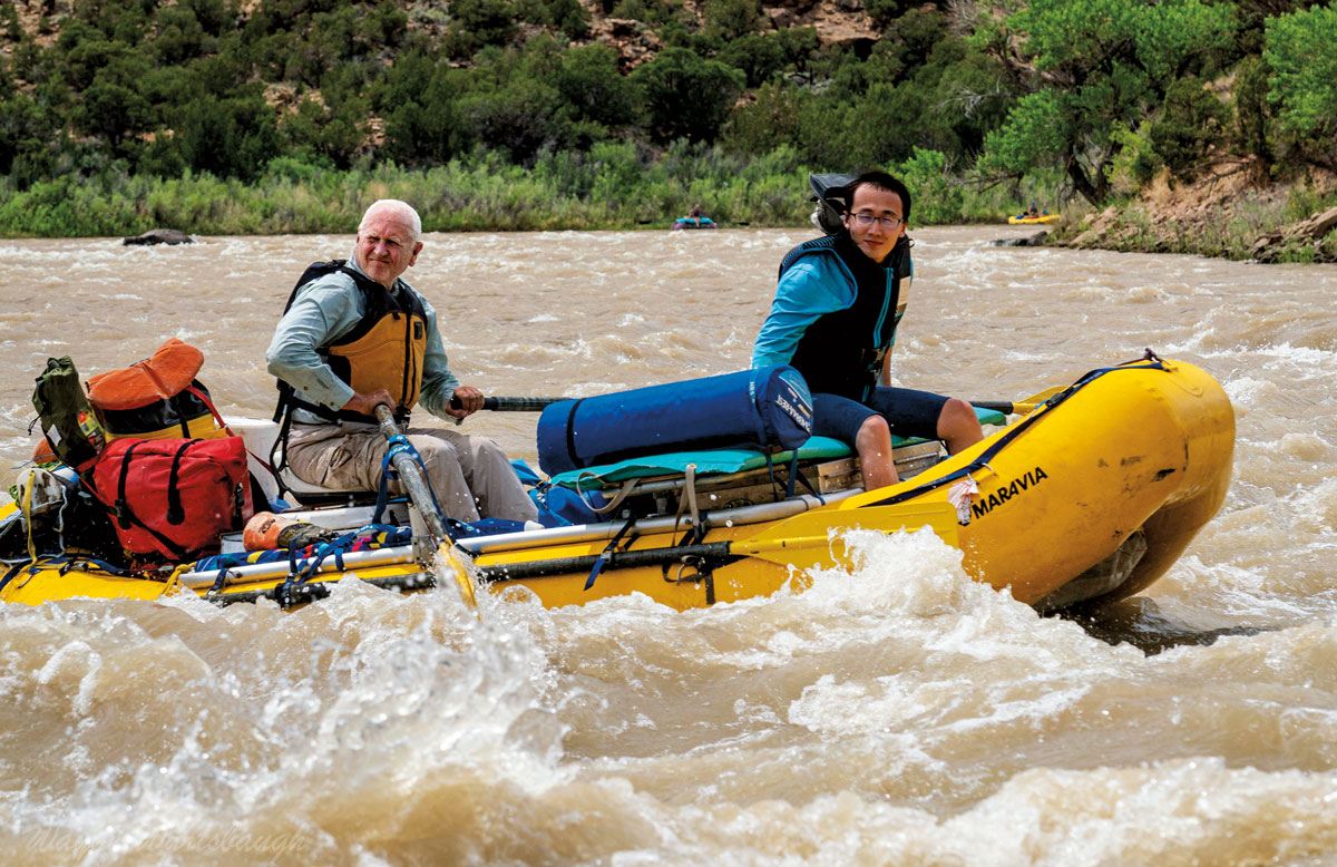 On the Green River, the longest headwaters tributary of the Colorado River, Jack Schmidt ’72 (left) shoots the rapids