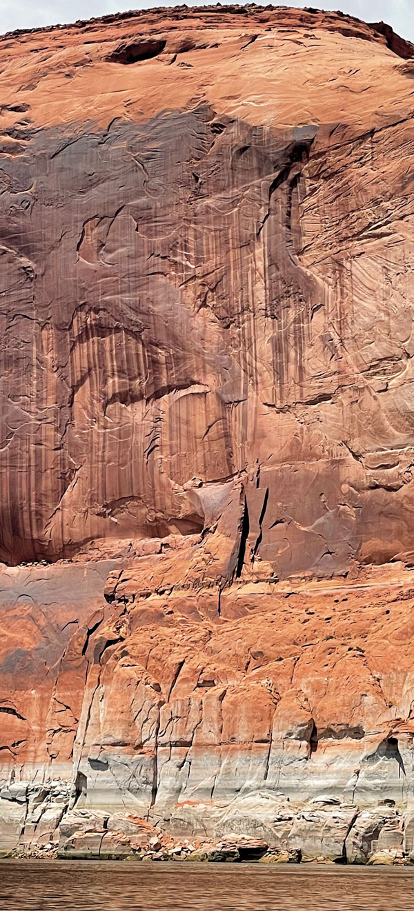 The Tapestry Wall, a cliff on the Colorado River, shows the bathtub ring at Lake Powell, whose water is even lower than Lake Mead's