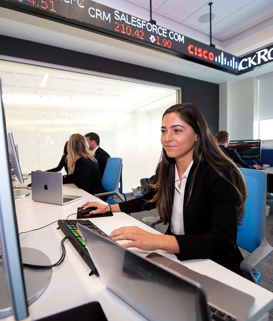 Emma Cashwell ’22 scans financial data on a Bloomberg terminal in the new Moriarty Investment Center