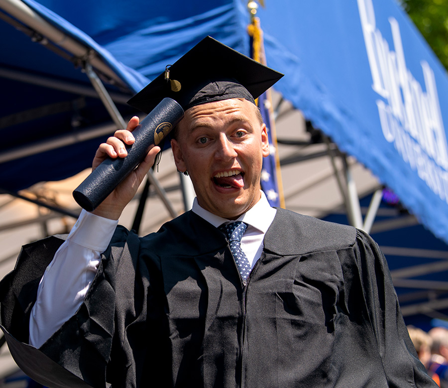 Bucknell graduate celebrates with his diploma