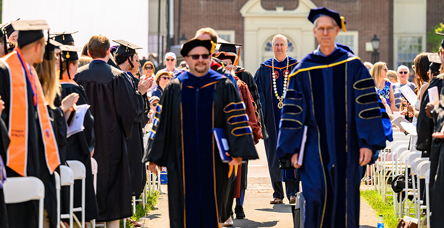 Bucknell graduates walk to the stage