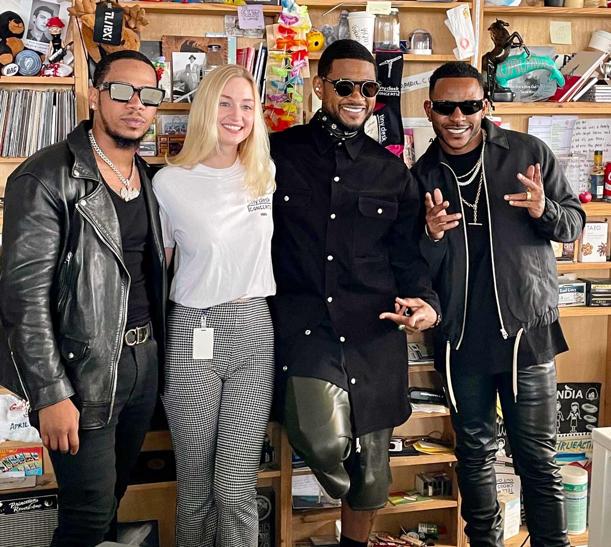Jill Britton standing with Vedo, Usher, and Eric Bellinger