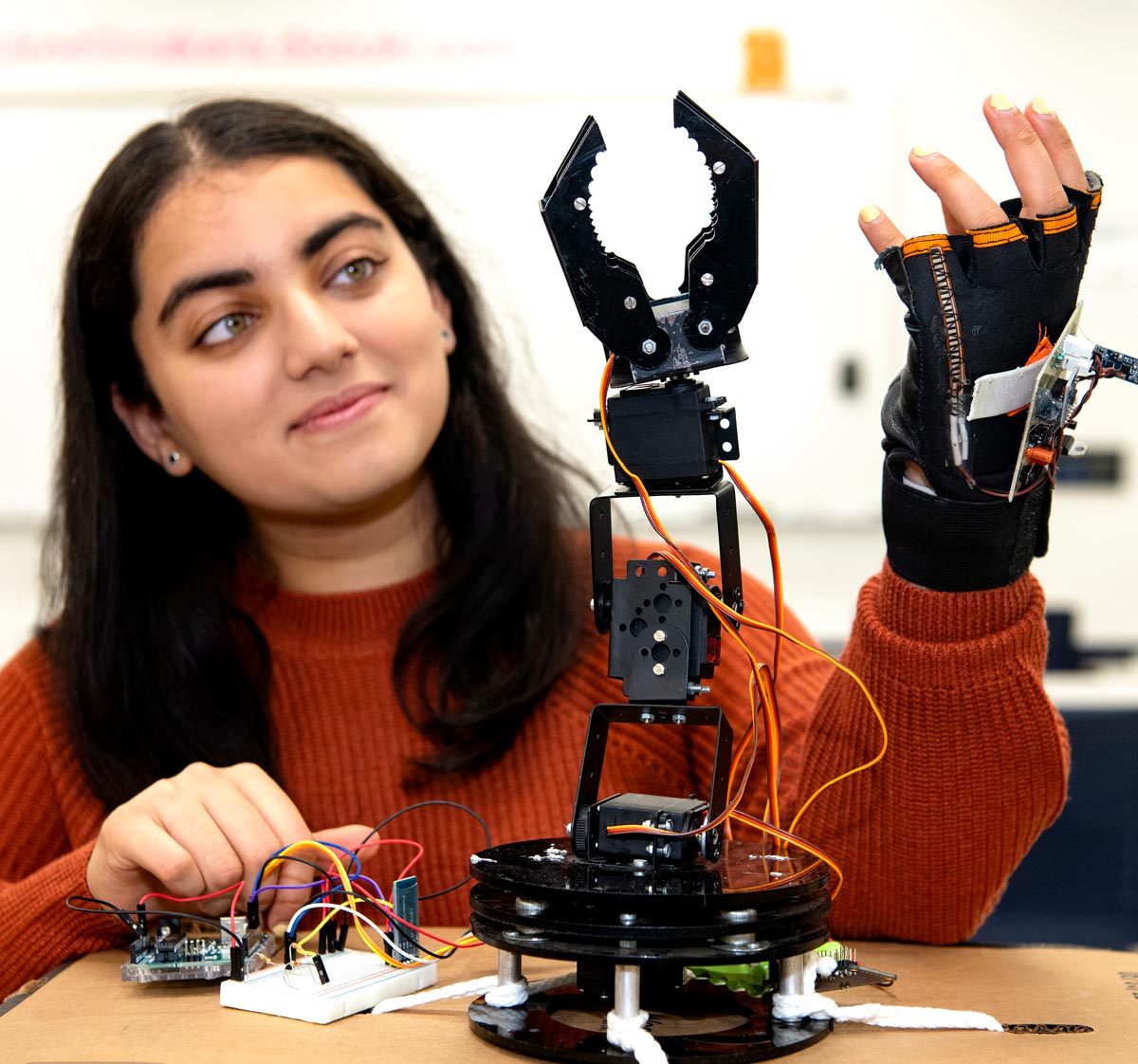 Aditi Vijayvergia, electrical engineering, develops a robotic arm in the Maker-E makerspace in Dana Engineering