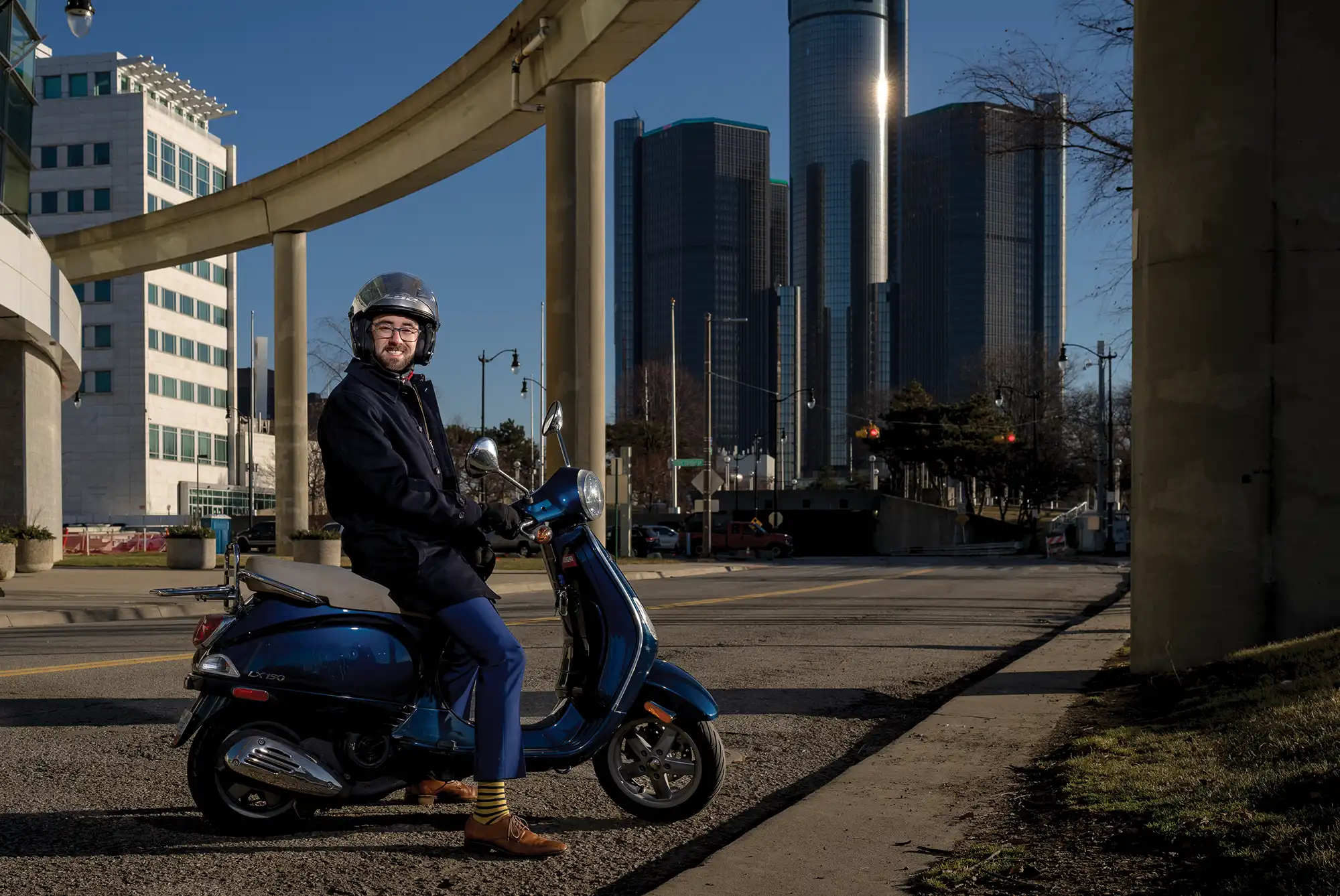 Sam Krassenstein on a parked motorbike in Detroit