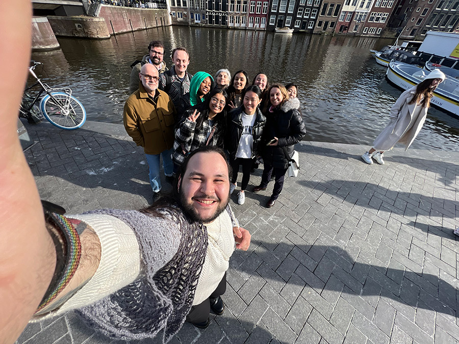 students smiling taking a selfie in Amsterdam