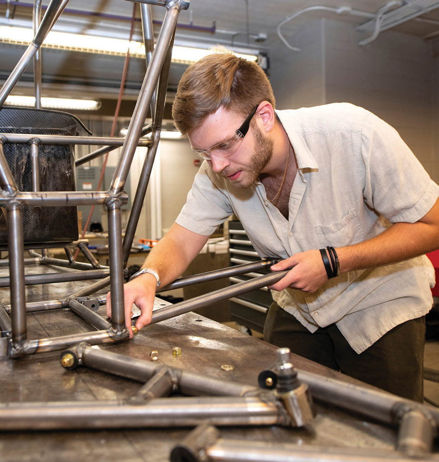 Elliot Thorp welding iron bars together