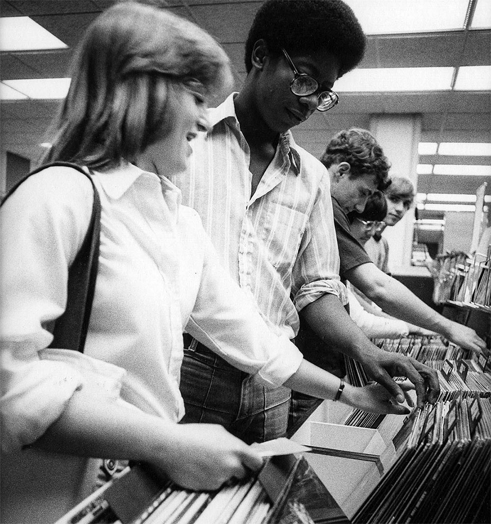 Vintage photo of students thumbing through vinyl records