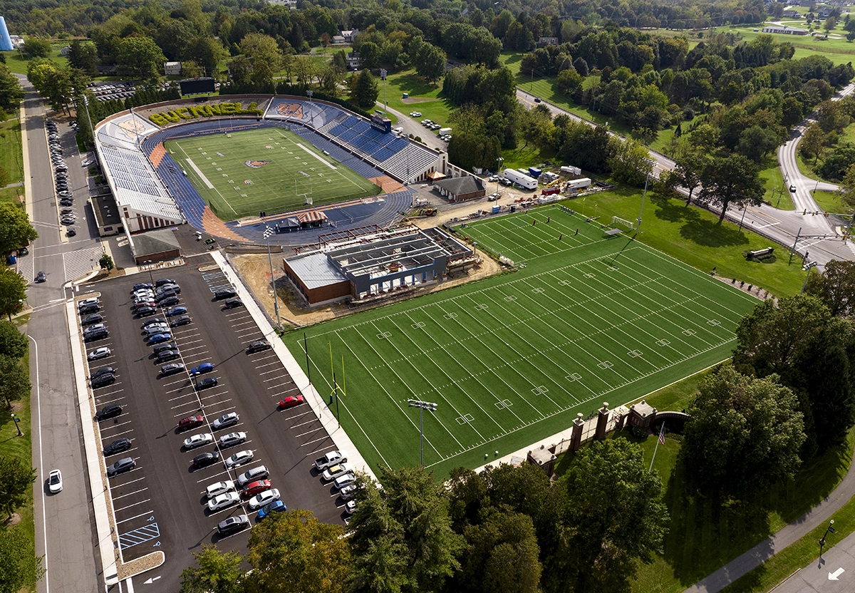 aerial view of football football field and parking lot