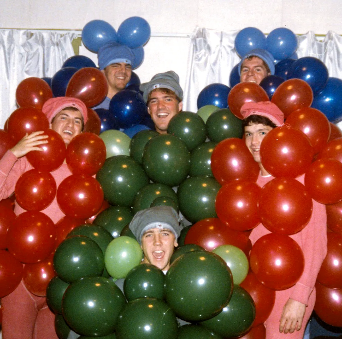 Chris Baker, Michael Gamboli, Reid Leslie, Trupe Ortlieb, Scott Yeager, and John Westrum posing while wearing homemade grapes costumes